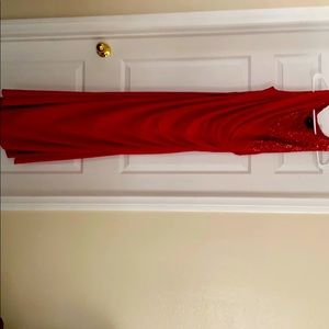 Red floor-length formal gown.